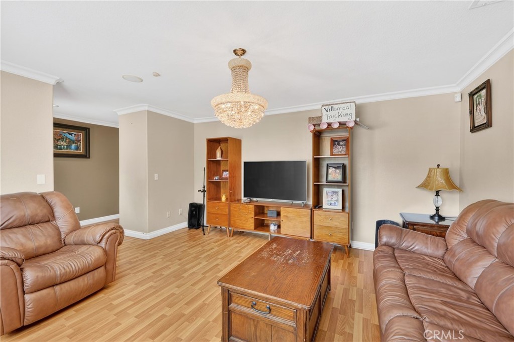 10939 Little Lake Road Downey, CA 90241 - Photo 8 of 55 a living room with furniture and a flat screen tv