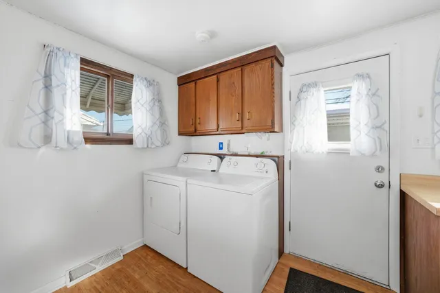 a bathroom with a sink a mirror and a window