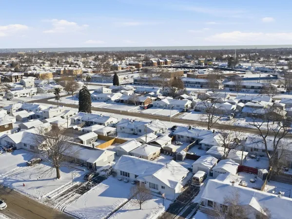 an aerial view of residential building with parking space