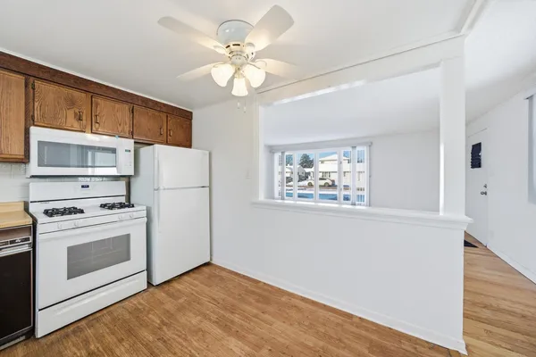 a view of a kitchen with electric appliances