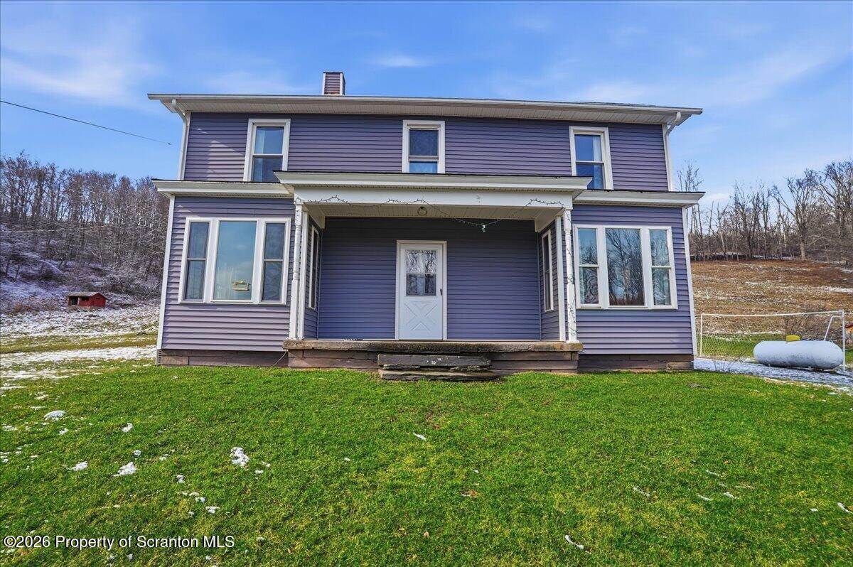 795 Wescott Road New Milford, PA 18834 - Photo 14 of 81 a front view of a house with garden