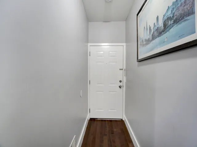 a bedroom with furniture and a flat screen tv