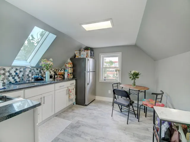 a bathroom with a toilet and a shower curtain