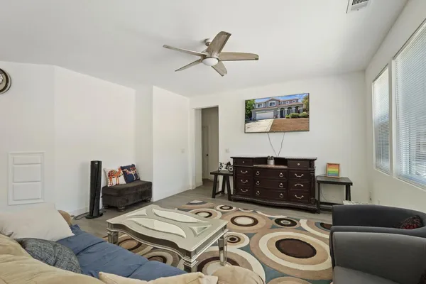 a living room with furniture and a window