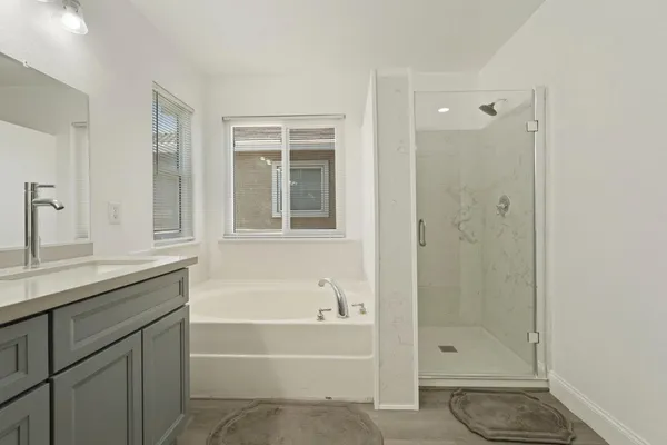 a view of walk in closet with clothes
