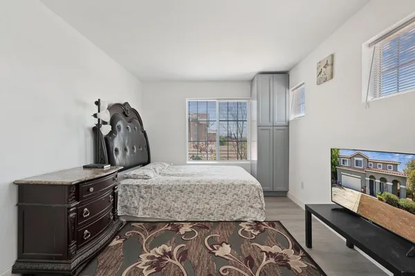 a bedroom with a bed and a dresser