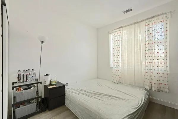 a front view of a house with outdoor seating