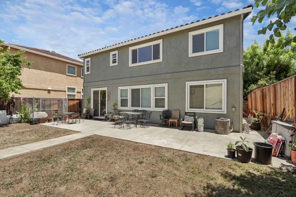 a front view of a house with yard patio and fire pit