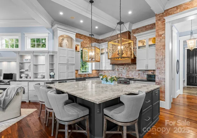 a kitchen with stainless steel appliances granite countertop a stove and a sink