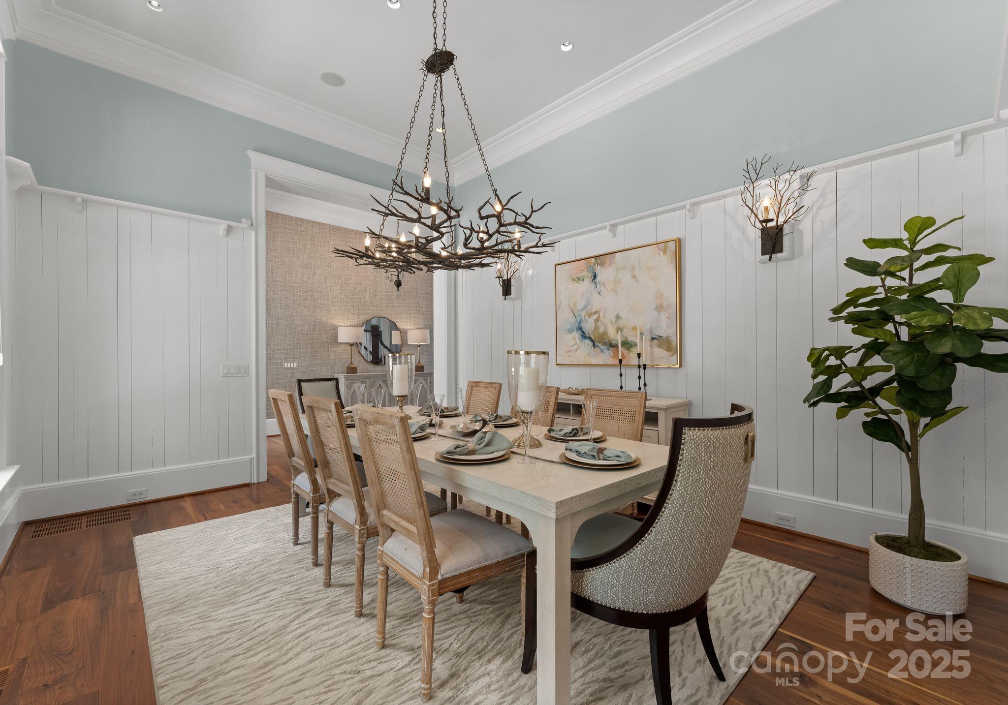 16921 Jetton Road Cornelius, NC 28031 - Photo 15 of 46 a view of a dining room with furniture and chandelier
