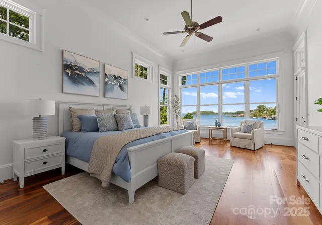 a spacious bathroom with a granite countertop sink a large mirror a shower and a bathtub