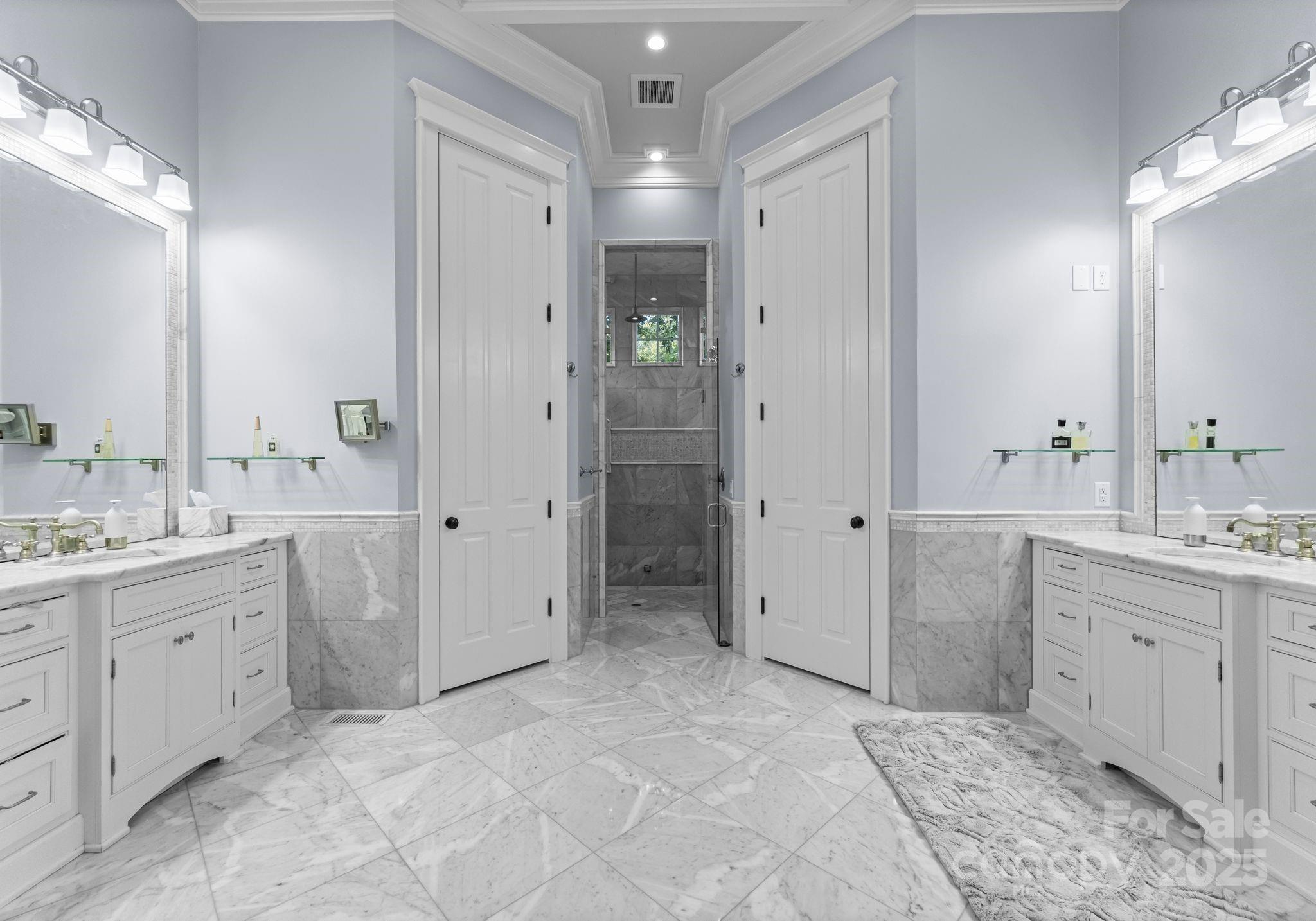 16921 Jetton Road Cornelius, NC 28031 - Photo 17 of 46 a spacious bathroom with a granite countertop sink a large mirror a shower and a bathtub
