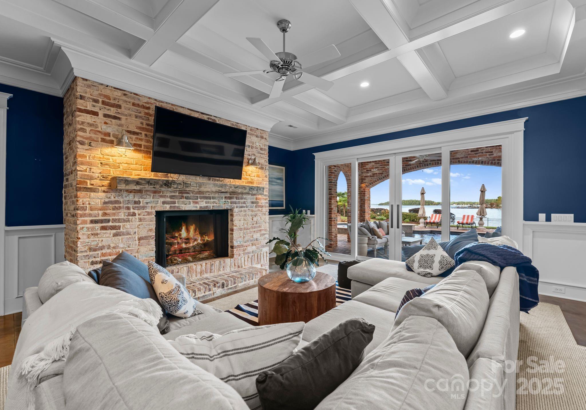 16921 Jetton Road Cornelius, NC 28031 - Photo 26 of 46 a living room with furniture fireplace and a large window