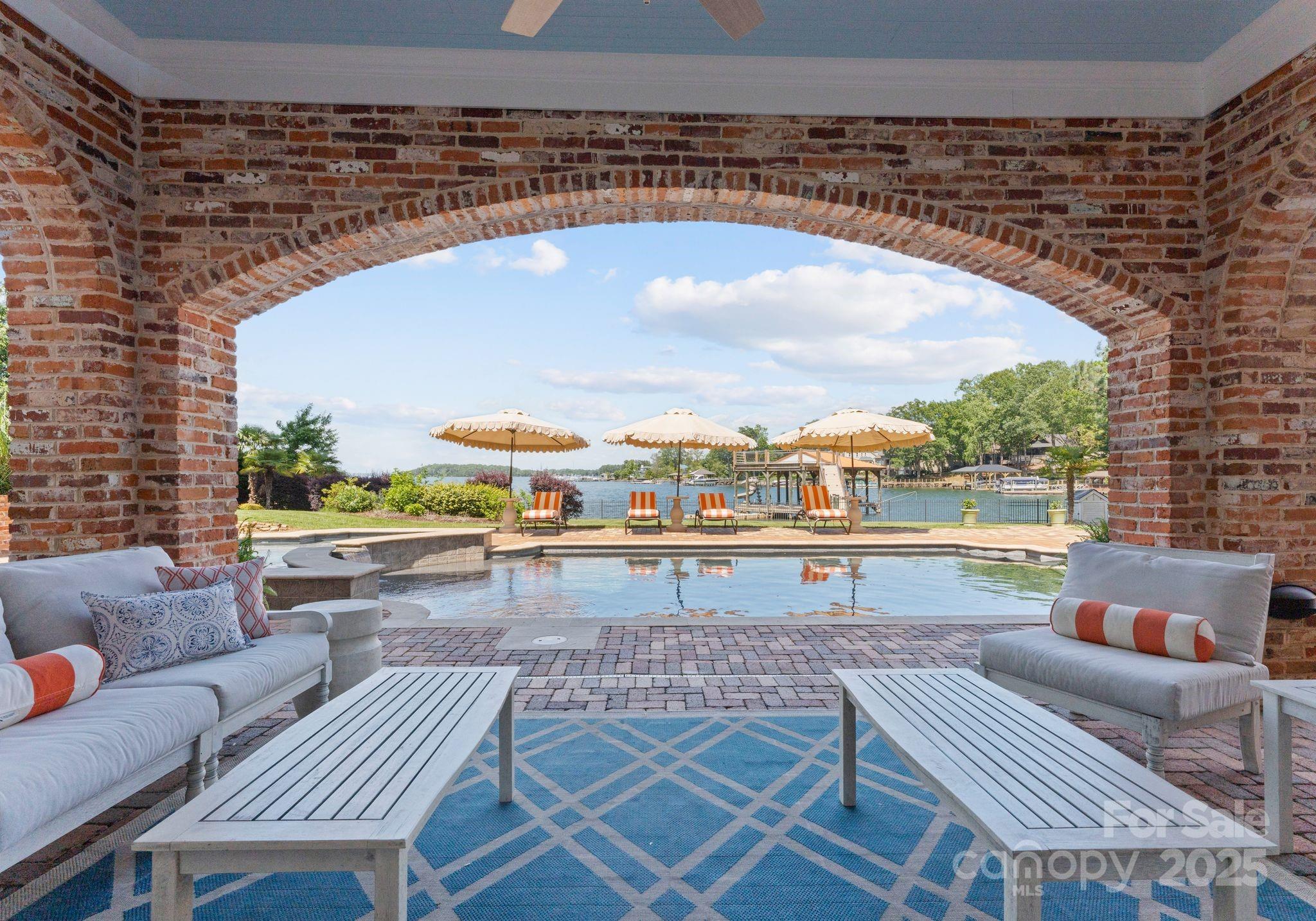 16921 Jetton Road Cornelius, NC 28031 - Photo 30 of 46 a terrace with outdoor seating and city view