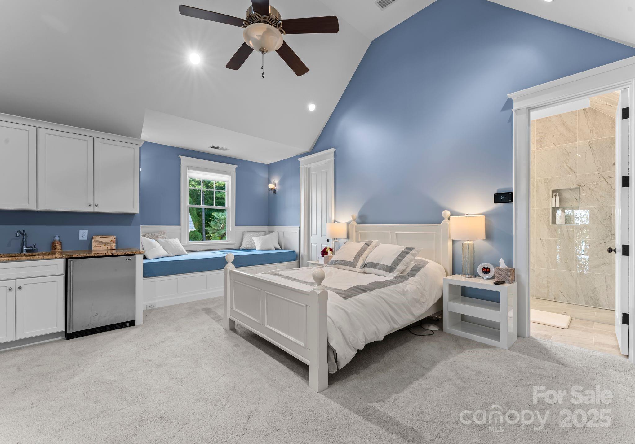 16921 Jetton Road Cornelius, NC 28031 - Photo 33 of 46 a spacious bedroom with a bed and a cabinets