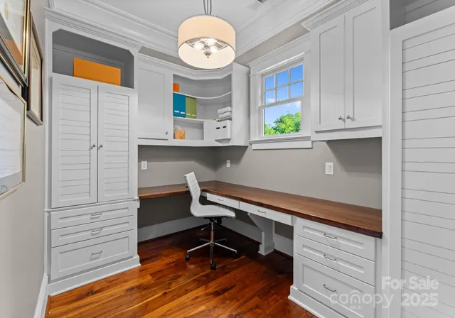 a balcony with furniture and a floor to ceiling window