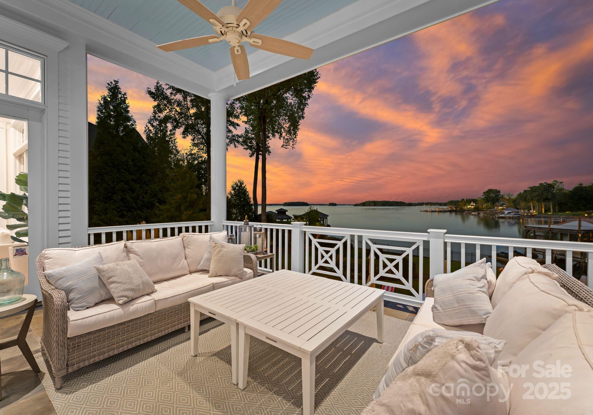 16921 Jetton Road Cornelius, NC 28031 - Photo 45 of 46 a balcony with furniture and a floor to ceiling window
