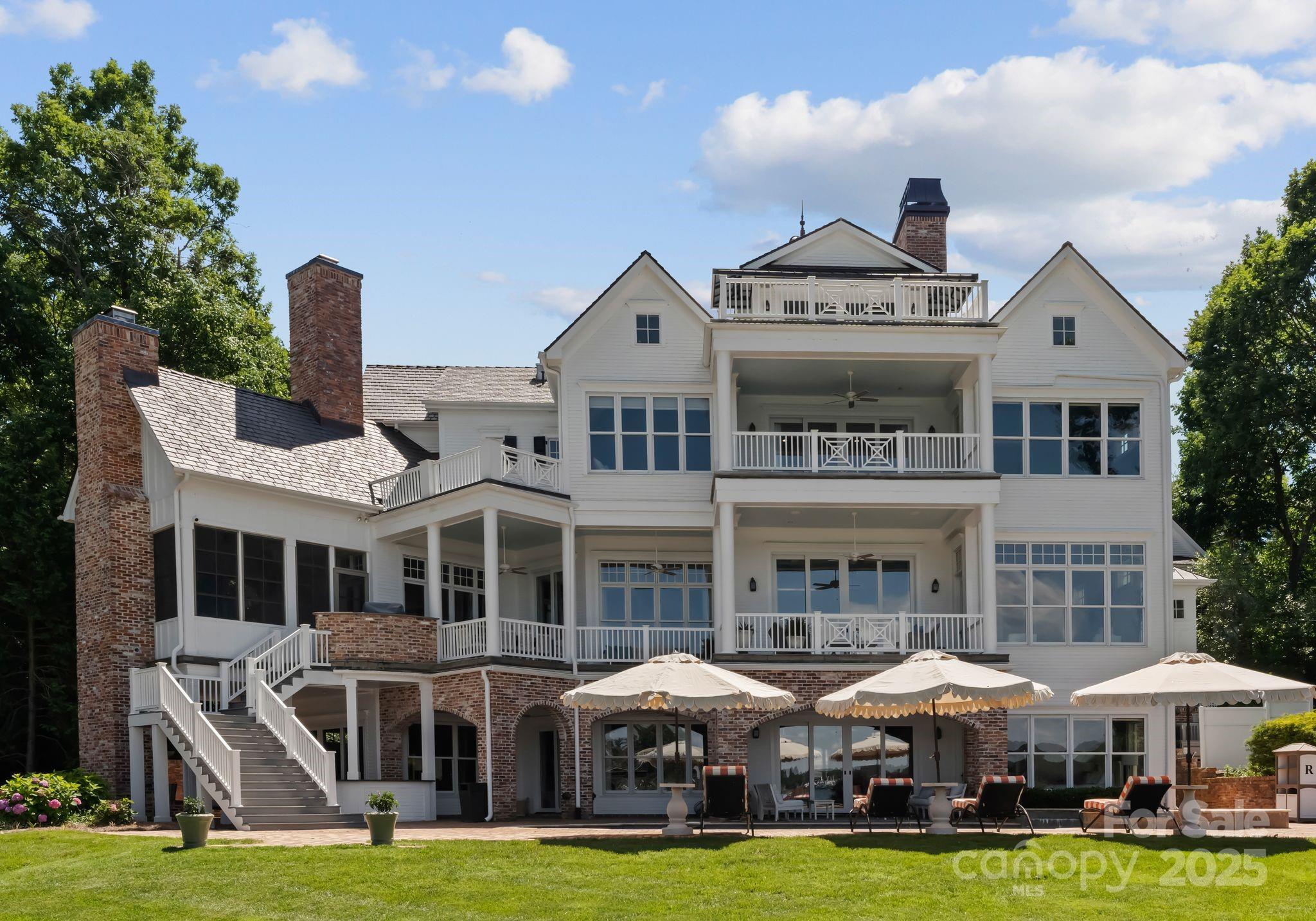 16921 Jetton Road Cornelius, NC 28031 - Photo 5 of 46 a front view of a residential apartment building with a yard
