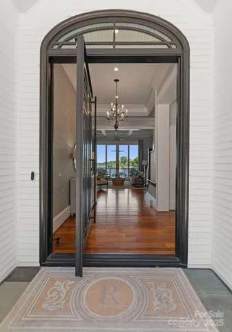 a view of water heater room with staircase and door