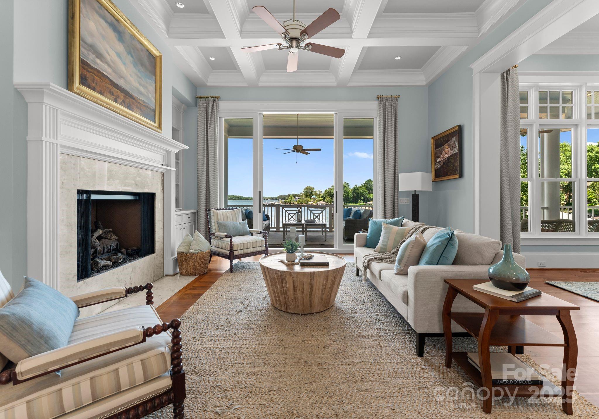 16921 Jetton Road Cornelius, NC 28031 - Photo 8 of 46 a living room with furniture a window and a fireplace