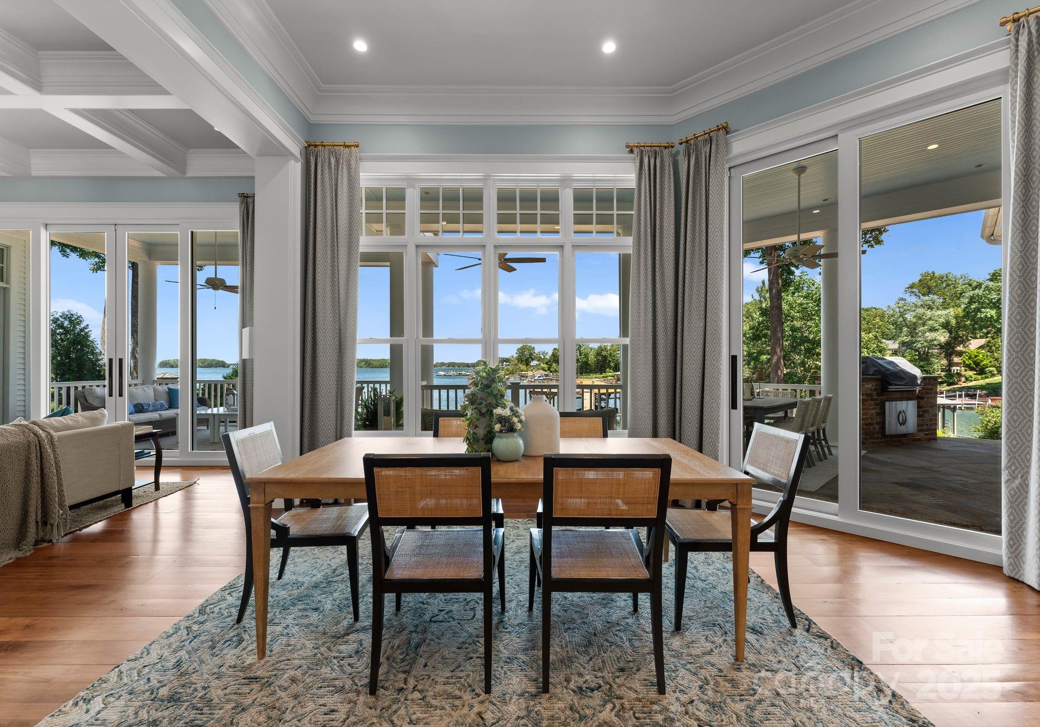 16921 Jetton Road Cornelius, NC 28031 - Photo 9 of 46 a dining room with furniture window and wooden floor