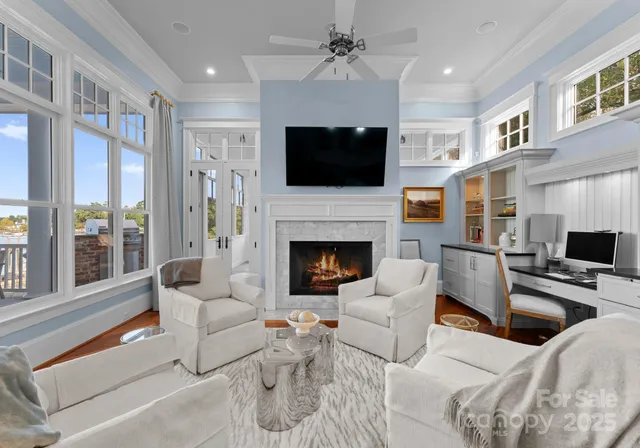 a kitchen with stainless steel appliances granite countertop a kitchen island a stove and a sink