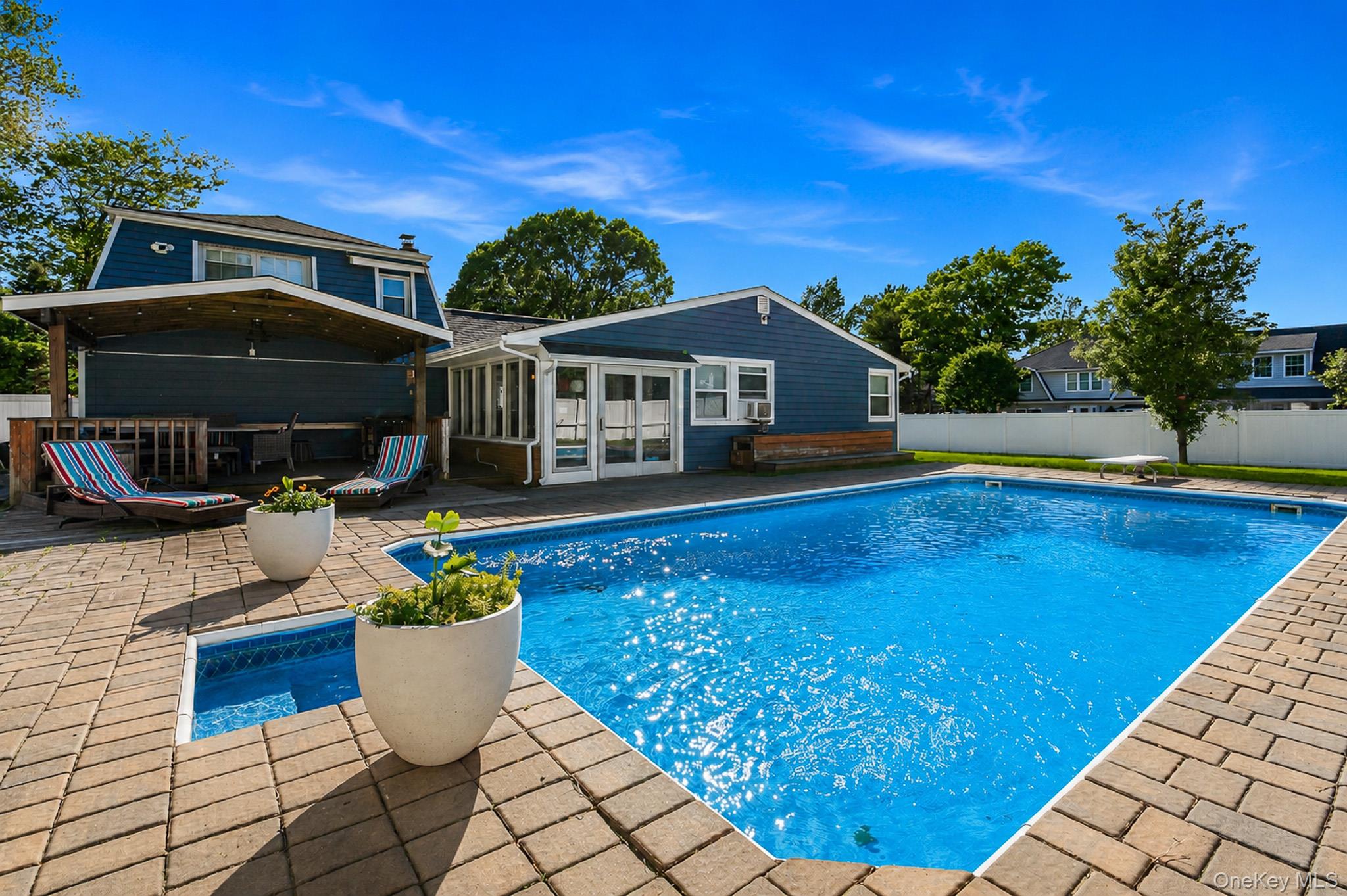 33 Lillian Road Nesconset, NY 11767 - Photo 29 of 42 Another View Of The Spectacular Country Club Backyard Offering A Beautiful Saltwater In Ground Pool, Diving Board, Expansive Paver Patios & Paver Pool Surround, And A Wonderful Covered Deck - Perfect For Entertaining & Barbequing!