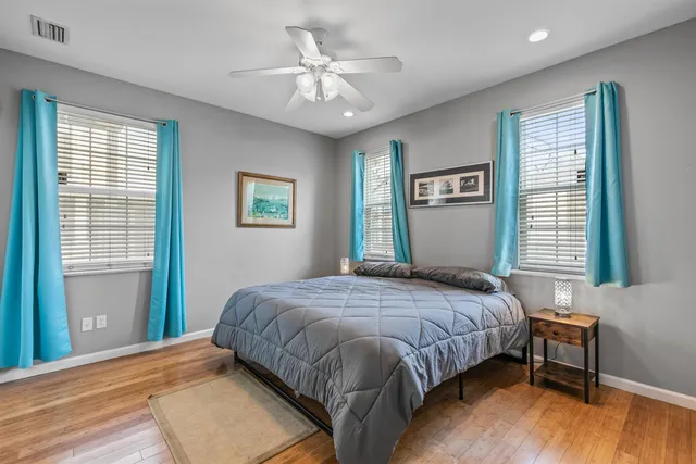 a bedroom with furniture and a window
