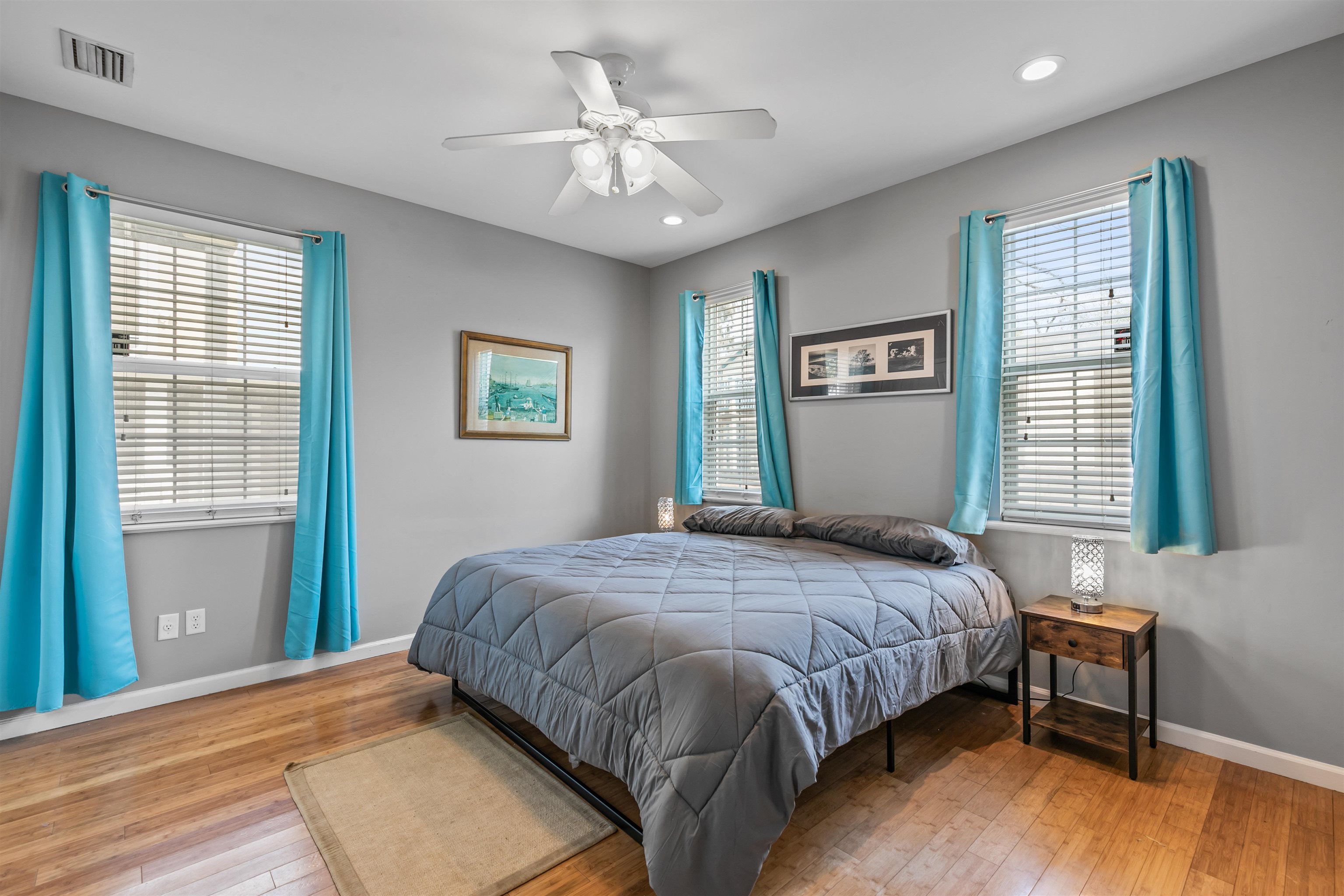 28 Spring Street St. Augustine, FL 32084 - Photo 9 of 35 a bedroom with a large bed and a chandelier