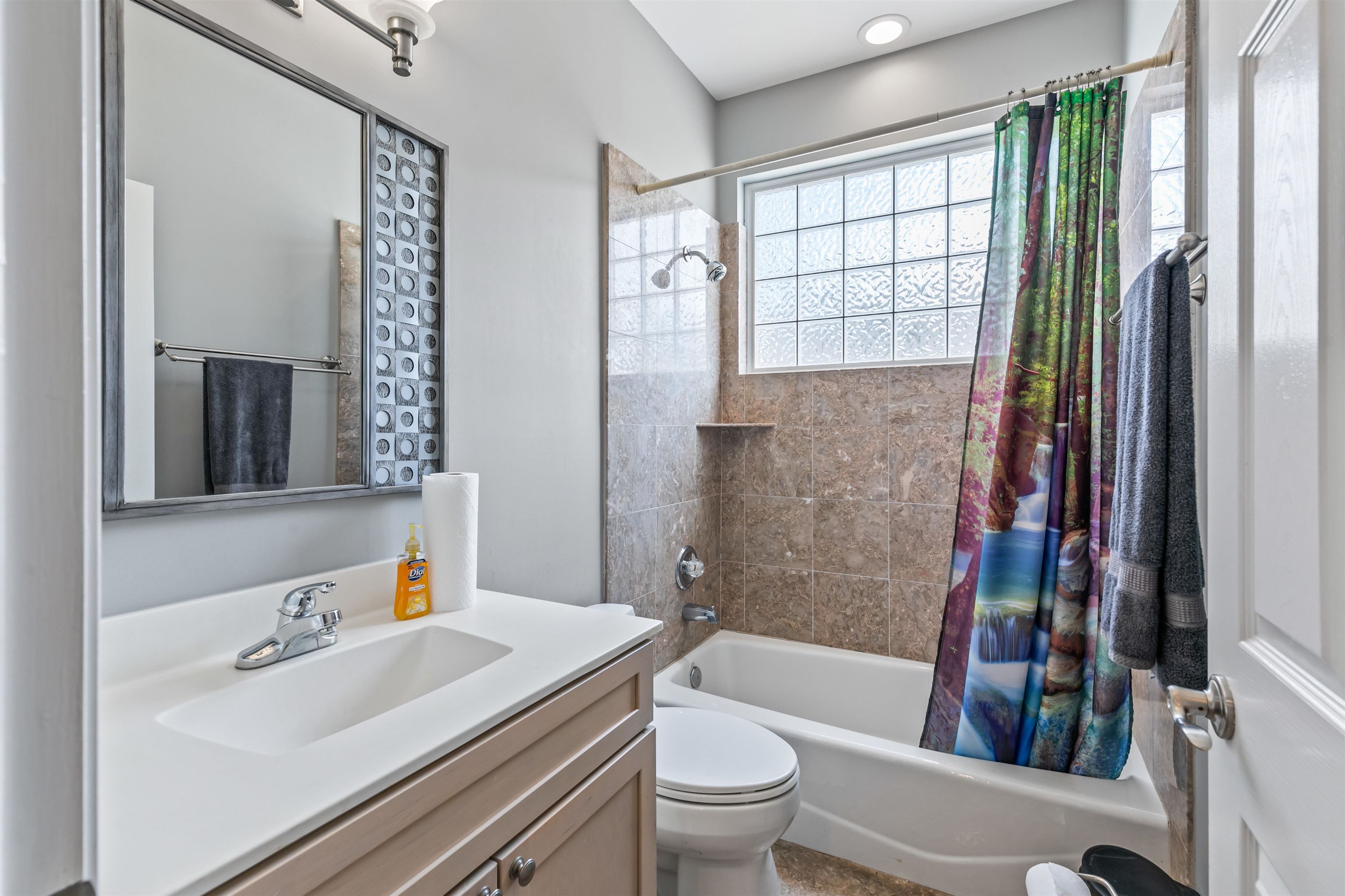 28 Spring Street St. Augustine, FL 32084 - Photo 14 of 36 a bathroom with a sink toilet tub and shower