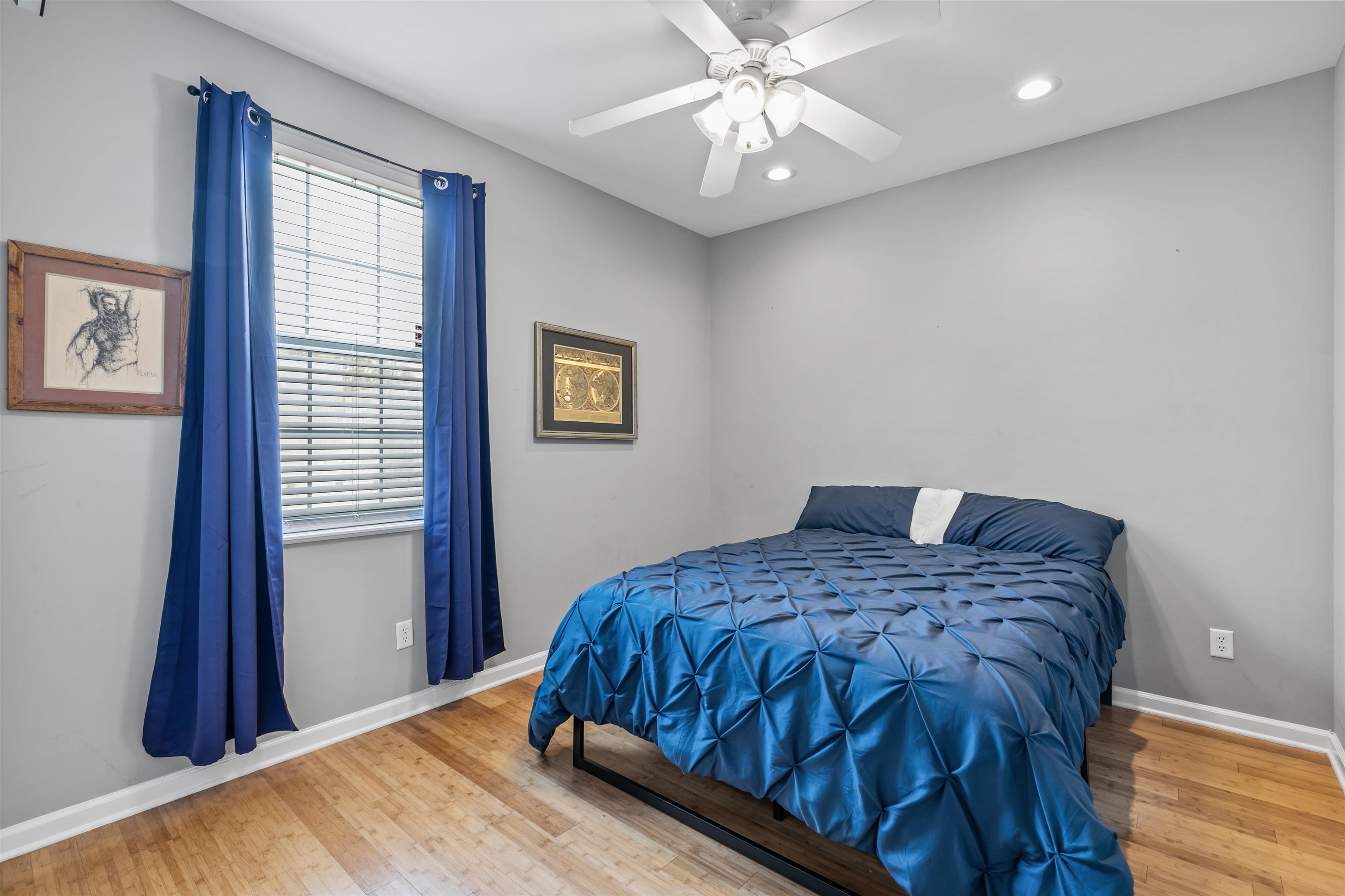 28 Spring Street St. Augustine, FL 32084 - Photo 12 of 35 a bedroom with a bed and a chandelier