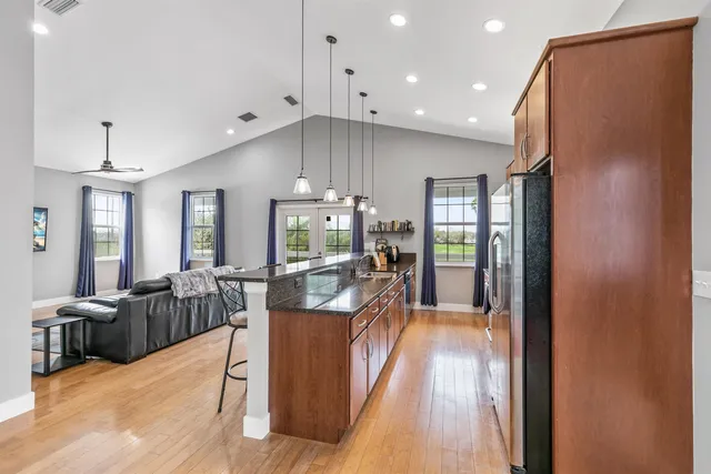 a view of a house with a yard and garage