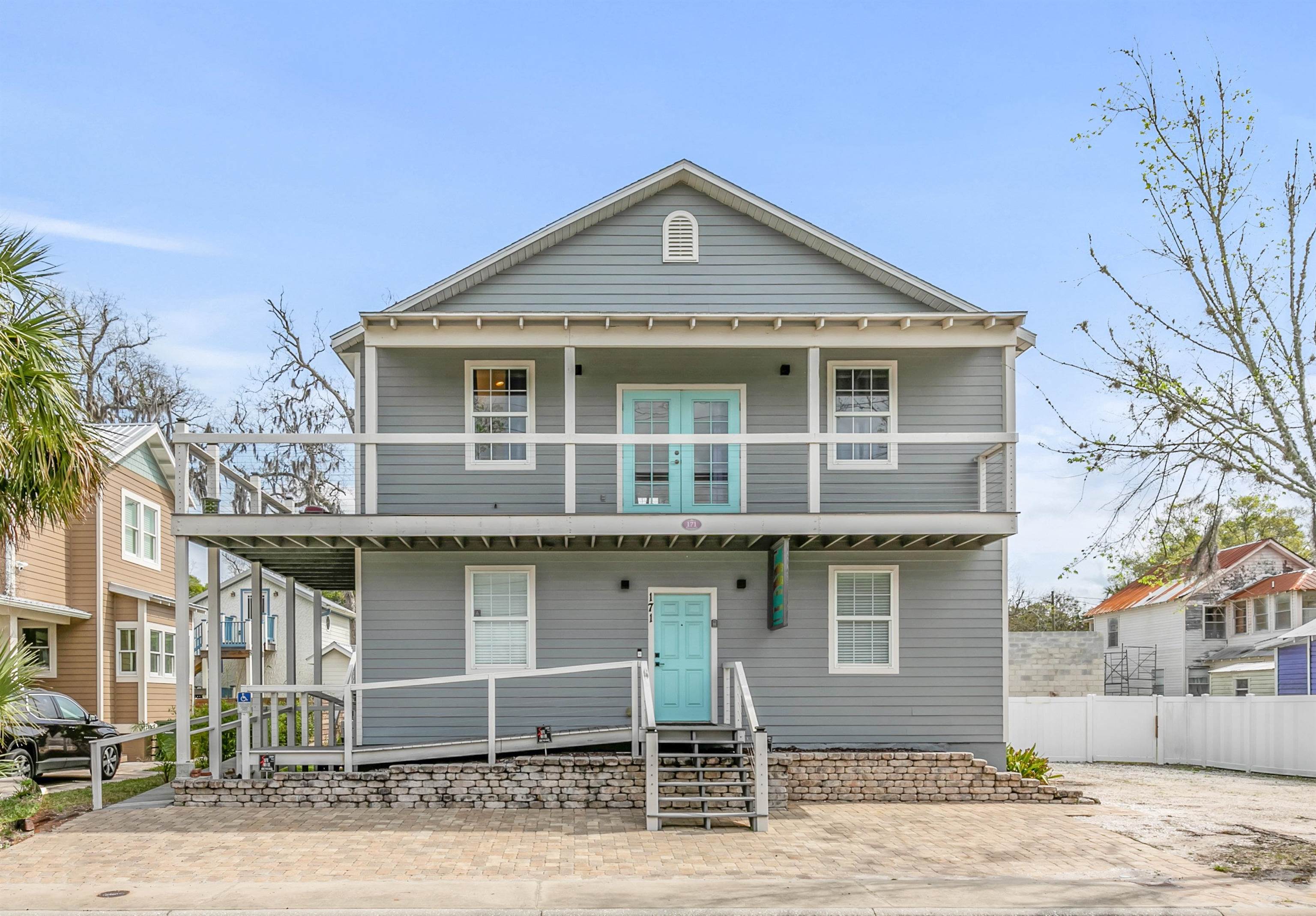 28 Spring Street St. Augustine, FL 32084 - Photo 2 of 35 a front view of a house with a yard