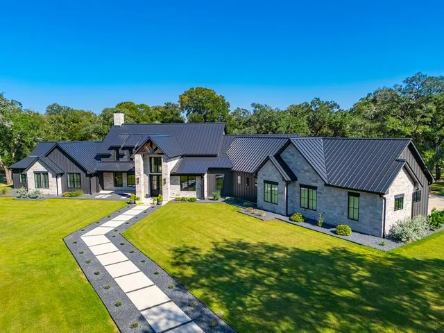 a view of a house with a big yard
