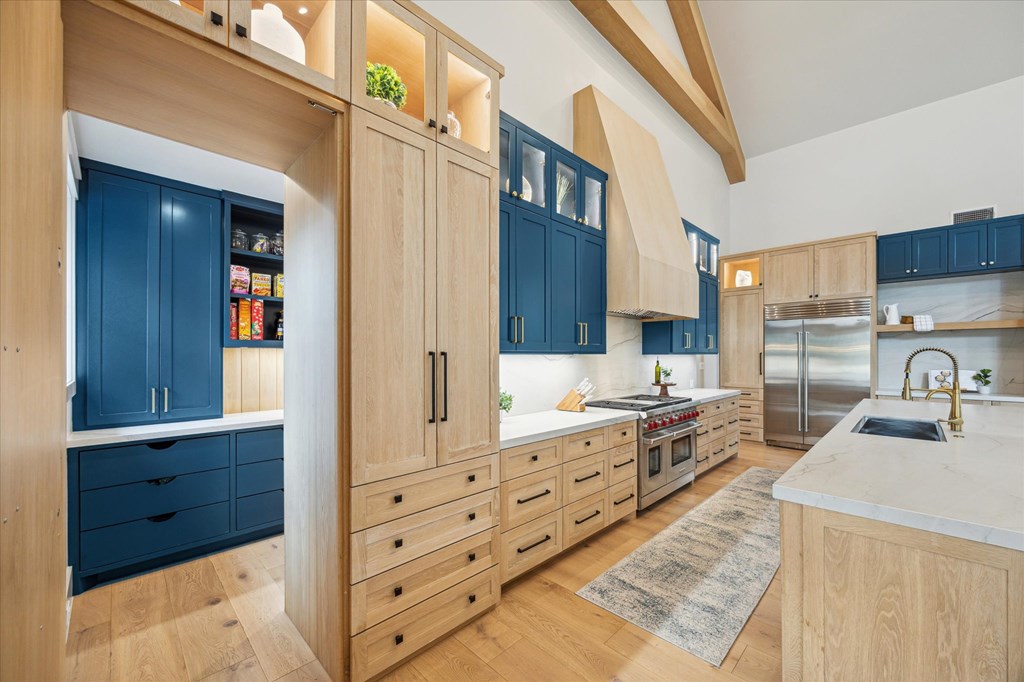 1301 County Road 218 Weimar, TX 78962 - Photo 16 of 55 a kitchen with granite countertop a sink stove and cabinets