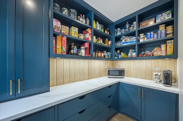 a kitchen with wooden cabinets and a window