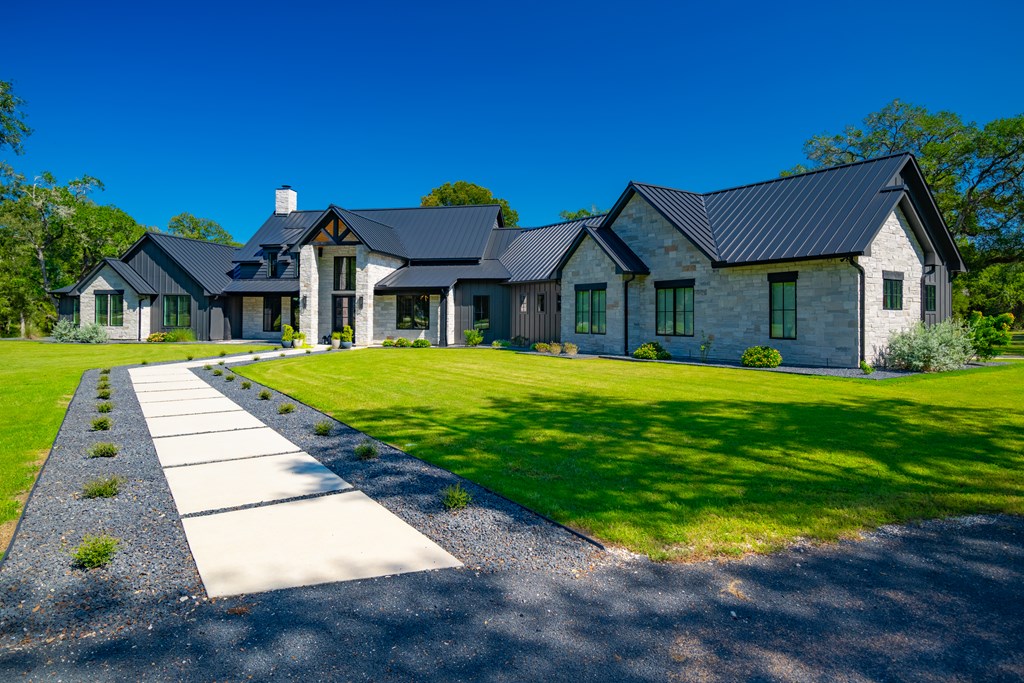 1301 County Road 218 Weimar, TX 78962 - Photo 2 of 55 a front view of house with yard and green space