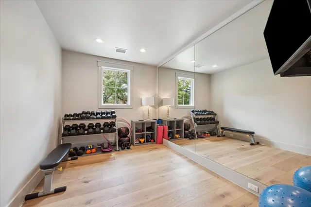 a room with lots of gym equipment