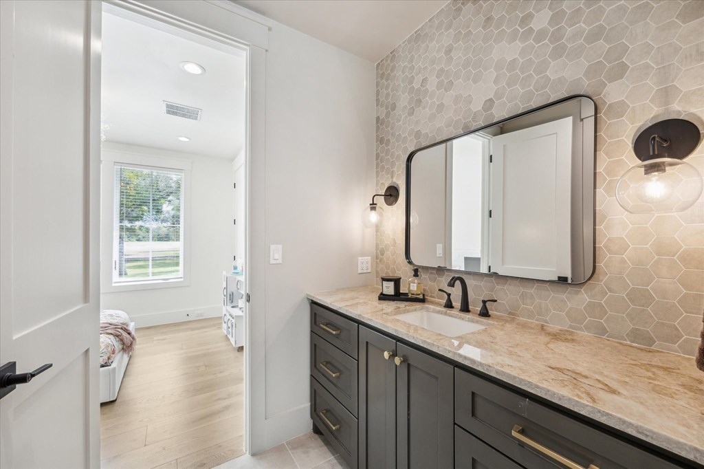 1301 County Road 218 Weimar, TX 78962 - Photo 30 of 55 a bathroom with a granite countertop sink mirror and double