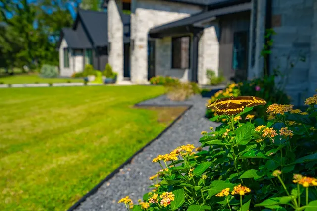a front view of a house with garden