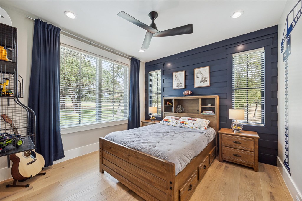 1301 County Road 218 Weimar, TX 78962 - Photo 31 of 55 a bedroom with a bed and large windows