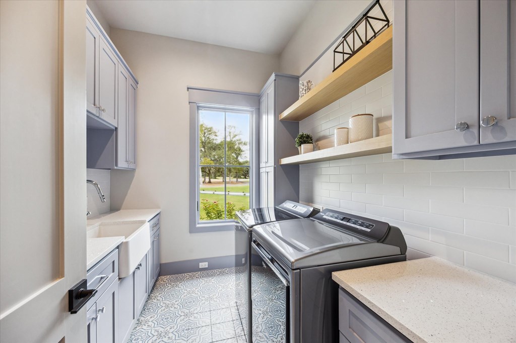 1301 County Road 218 Weimar, TX 78962 - Photo 35 of 55 a utility room with cabinets washer and dryer