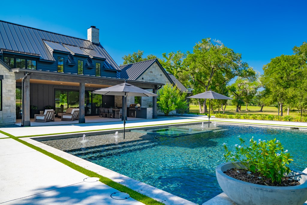 1301 County Road 218 Weimar, TX 78962 - Photo 40 of 55 a view of a house with swimming pool and sitting area