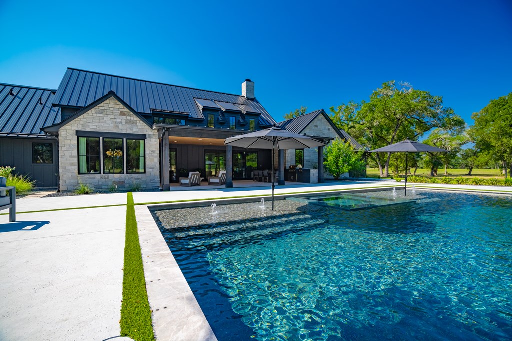 1301 County Road 218 Weimar, TX 78962 - Photo 41 of 55 a view of a house with a swimming pool