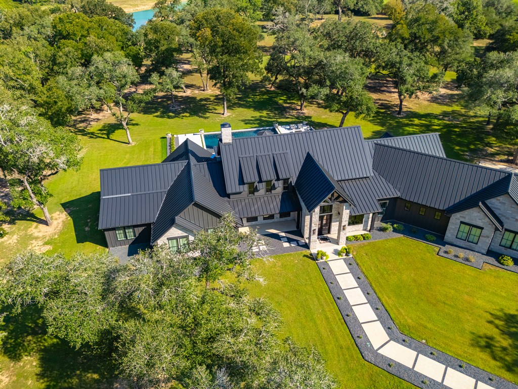 1301 County Road 218 Weimar, TX 78962 - Photo 50 of 55 an aerial view of a house with swimming pool and large trees