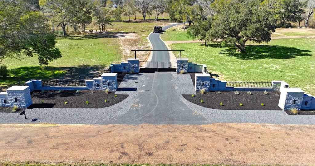1301 County Road 218 Weimar, TX 78962 - Photo 54 of 55 a view of a swimming pool with a patio and plants