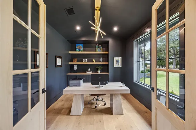 a bedroom with furniture and a potted plant