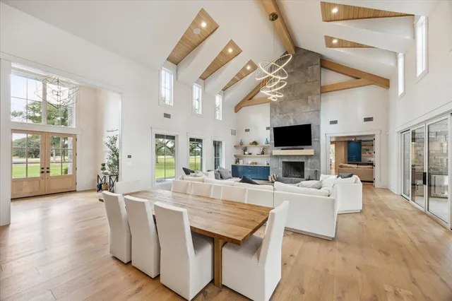a living room with fireplace furniture and a flat screen tv