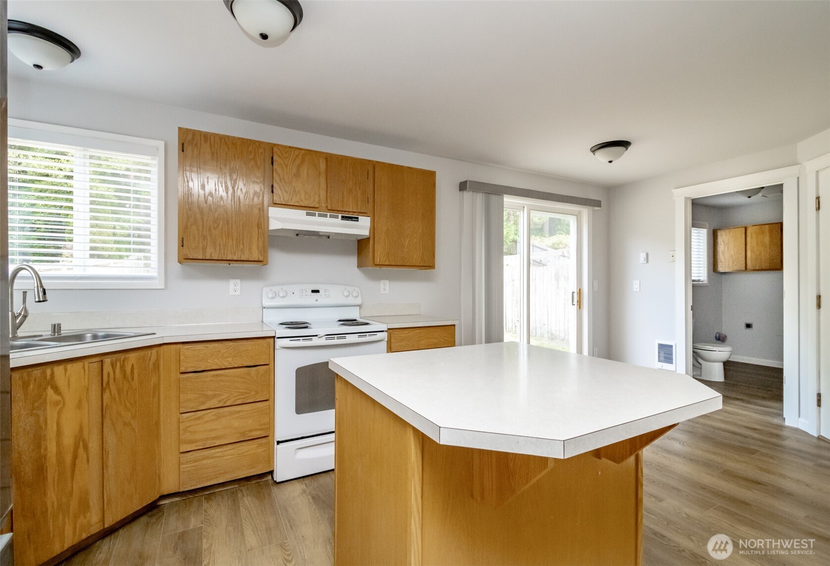 5823 186th Ave Court East, Unit A Lake Tapps, WA 98391 - Photo 13 of 27 a kitchen with stainless steel appliances granite countertop a sink stove and refrigerator