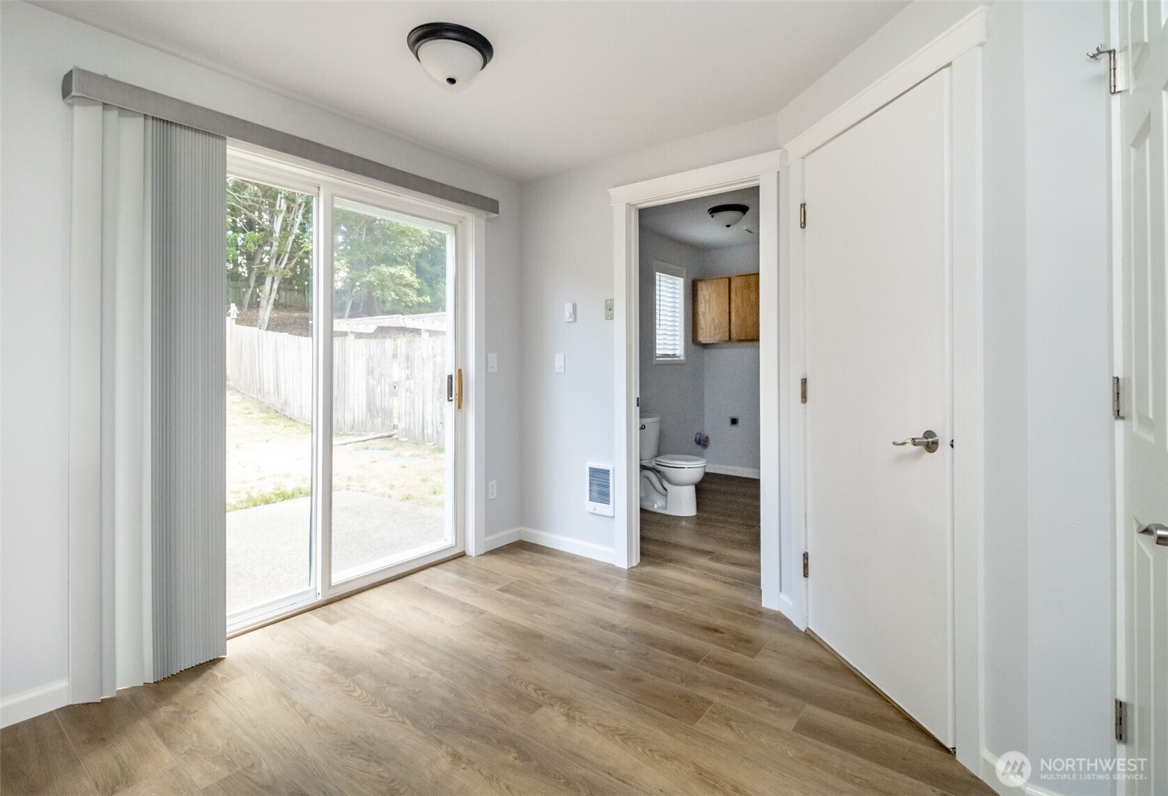5823 186th Ave Court East, Unit A Lake Tapps, WA 98391 - Photo 15 of 27 a view of a big room with wooden floor and windows